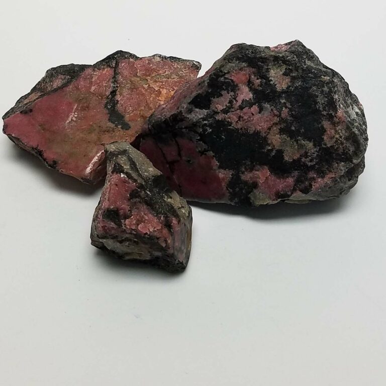 Rough Rhodonite Chunks, One Face Polished